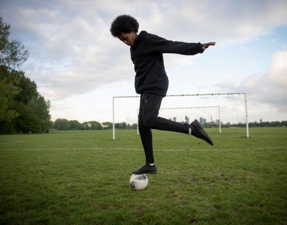 Teenager playing football