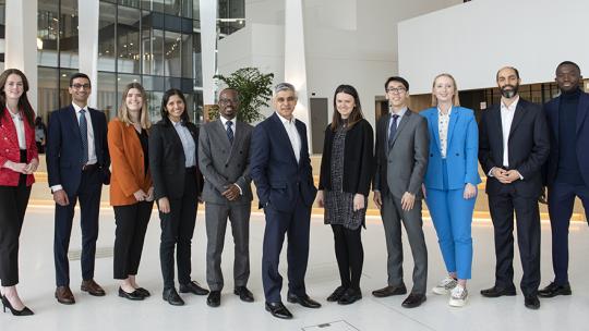 The Mayor of London standing with the official Mayor's Young Professional Panel