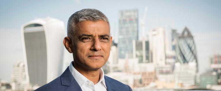 Mayor of London Sadiq Khan posing in front of City of London